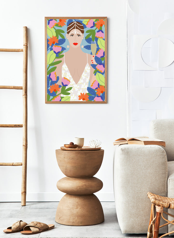Illustration of a woman with flowers and leaves around her. Summer Queen in Flowers by Rafaela Mascaro is a vibrant floral art print celebrating confidence, femininity, color, and lush botanical beauty.