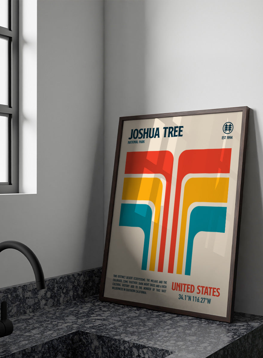 A retro-style poster for Joshua Tree National Park with bold geometric shapes in red, orange, yellow, and teal on a cream background, plus text reading &