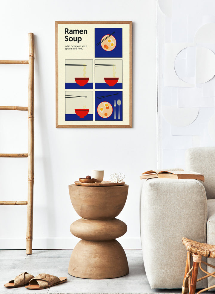 Illustration of ramen soup with chopsticks, a spoon, and fork on a blue background. Ramen Soup by Rosi Feist is a minimalist ramen art print with bold Bauhaus color, chopsticks, and playful humor. Officially licensed modern food poster.
