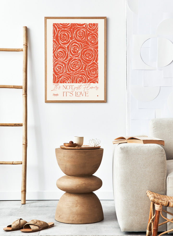 Pattern of red roses with text 'It's NOT just flowers IT'S LOVE' on a beige background. About Love. Smell of Roses by Maria Galybina is a floral art print with coral rose patterns and romantic typography. Modern love wall poster.
