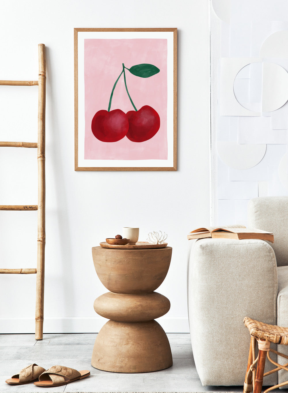 Two red cherries with a green stem on a pink background. Red cherries art print by Elena Ristova featuring two hand-painted cherries with green stems on a soft pink background. Officially licensed minimalist wall poster.