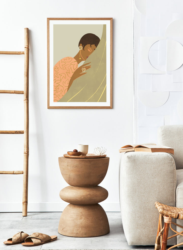 Illustration of a woman wrapped in a floral-patterned shawl with a neutral background. The Introvert by Arty Guava is a modern portrait illustration featuring a woman figure, soft color palette, contemporary wall art style, and officially licensed artwork.