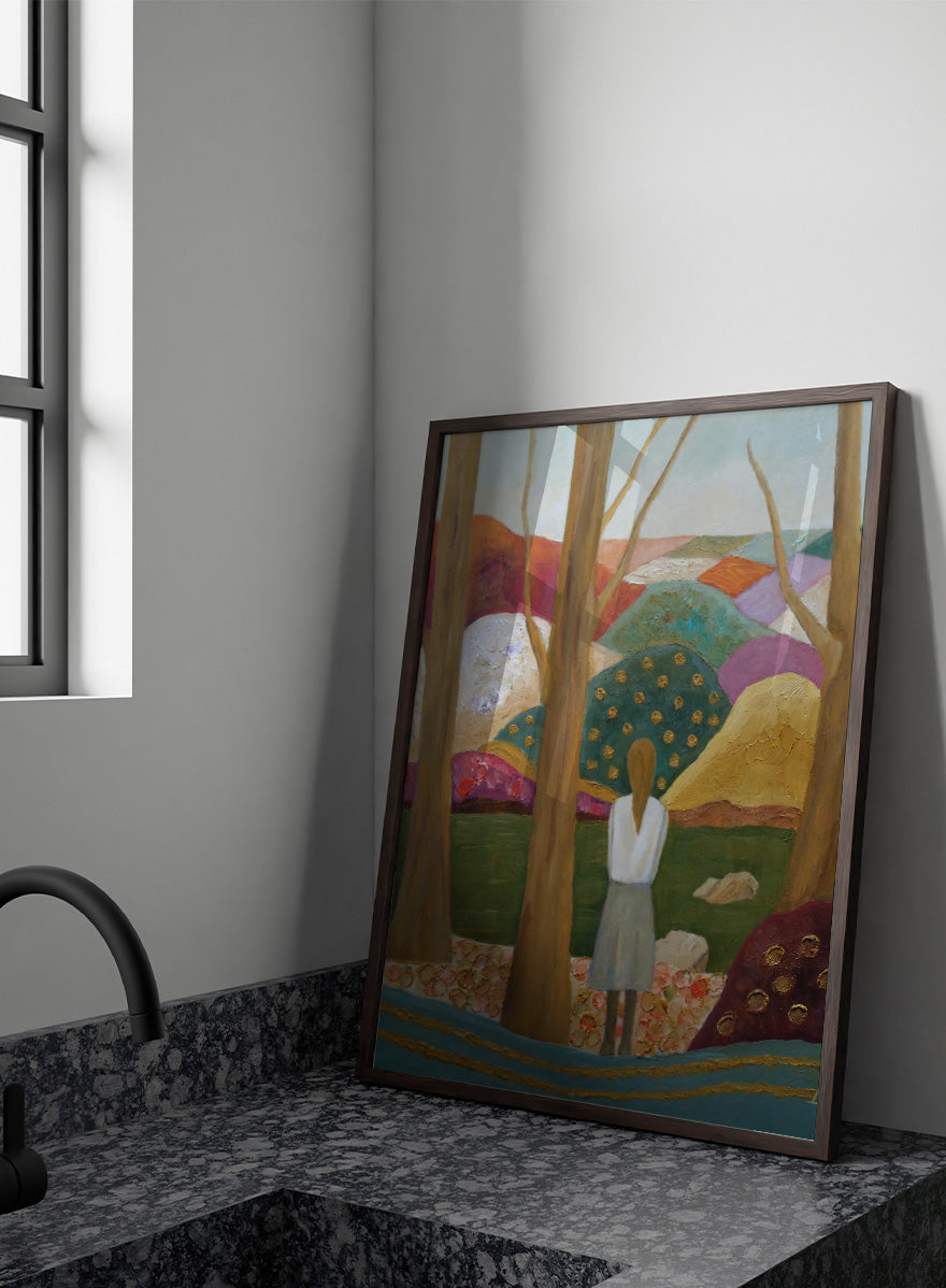 An expressive painting of a woman seen from behind standing among tall trees in a stylized landscape with colorful hills, patches of green, purple, pink, blue, and gold accents. Shop Woman Among Vibrant Hills by Angeles M. Pomata, a colorful landscape and portrait art print featuring a woman, rolling hills, trees, and earthy tones.