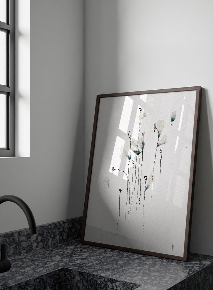 Minimalist watercolor floral art print featuring delicate calla lily-like stems and leaves in soft gray-green and black on textured white paper. Shop Delicate Abstract Flowers by Ankie Kooi, a modern floral wall art print poster with minimalist line art, abstract botanicals, soft blue, and green tones.