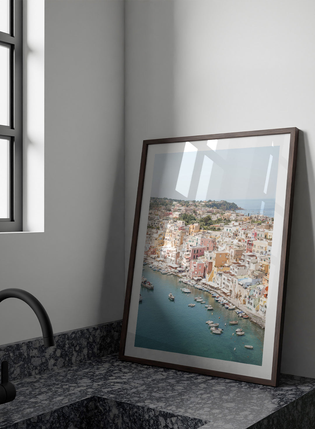 Coastal town with colorful buildings and boats in a harbor. Vibrant Italian Coastal Town by Henrike Schenk is a coastal photography print featuring pastel architecture, turquoise waters, fishing boats, and Mediterranean charm.