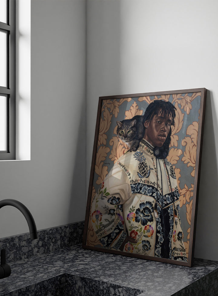 A stylized portrait painting of a Black man wearing an ornate cream jacket with colorful floral embroidery, seated against a patterned wallpaper background with a gray tabby cat on his shoulder. Shop Man and Cat Portrait by Damilare Jamiu, a contemporary figurative wall art print featuring a man with a cat, embroidered clothing, and rich floral detail.