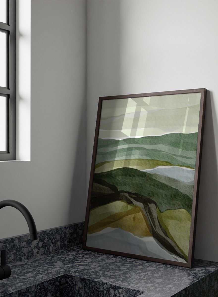Shop Serene Green Landscape by Nikita Jariwala, a modern abstract landscape art print featuring layered hills, rolling countryside, and soft green, olive, gray, and blue tones.