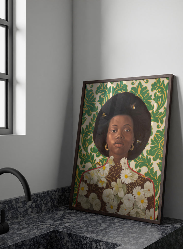 A stylized portrait artwork of a Black woman with an afro hairstyle, wearing gold hoop earrings and a brown top covered in white daisy flowers, set against a green and cream damask patterned background with small bees visible. Shop Afro Floral Portrait by Damilare Jamiu, a contemporary portrait wall art print featuring a woman with afro hair, floral details, bees, and rich green tones.