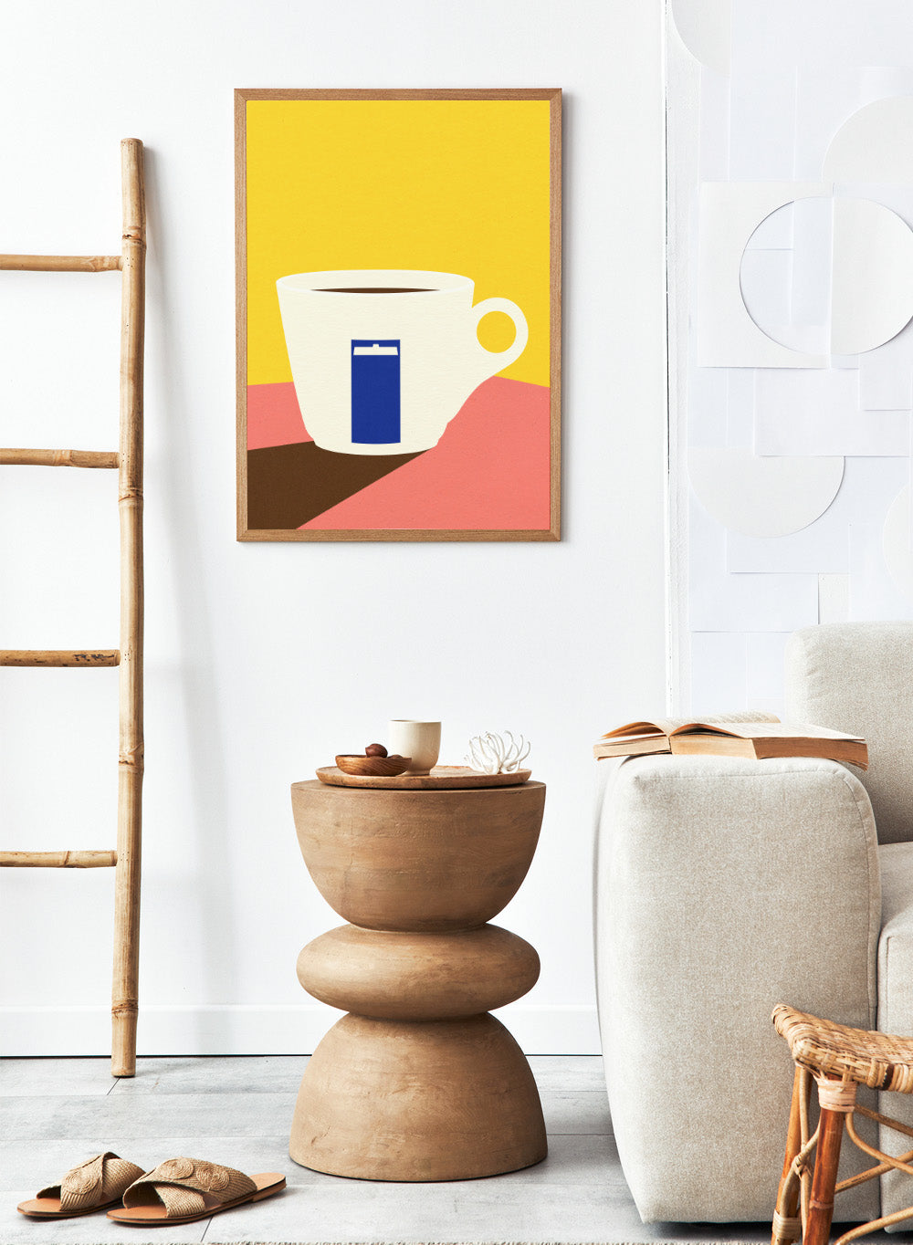 White coffee cup with a blue book design on a yellow and pink background. Tazza by Rosi Feist is a minimalist modern art print of a coffee cup in bold Bauhaus-inspired color blocks. Officially licensed fine art poster with framing.