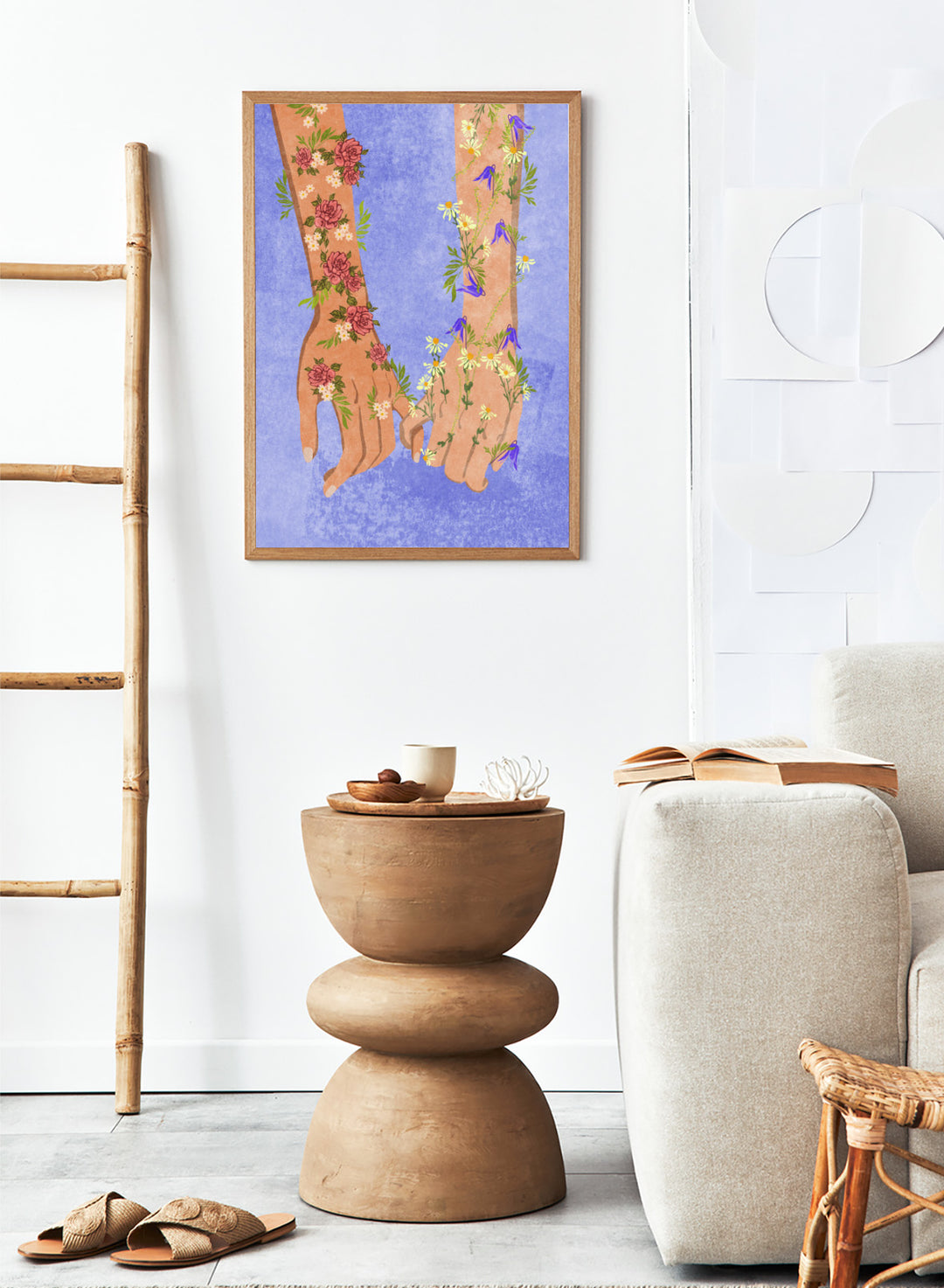 Illustration of two hands holding each other with floral designs on a blue background. Holding Hands by Raissa Oltmanns is a modern romantic fine art print featuring floral arms illustration and contemporary love wall decor poster.