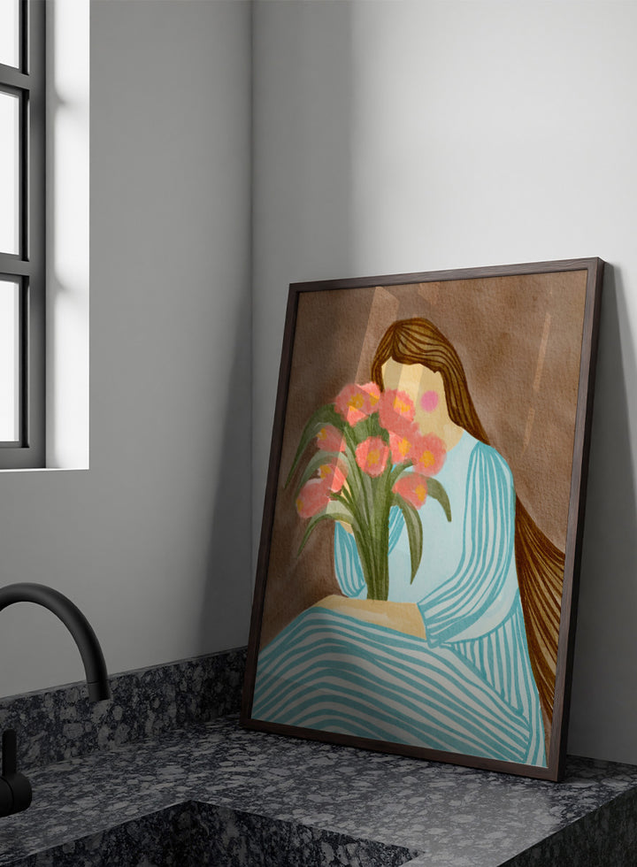 A stylized art print depicting a woman with long brown hair in a light blue striped dress holding a bouquet of pink tulips, set against a textured brown background. Shy Woman Pink Tulips by Nikita Jariwala, a figurative wall art print poster with pink tulips, blue dress illustration, and romantic floral decor.