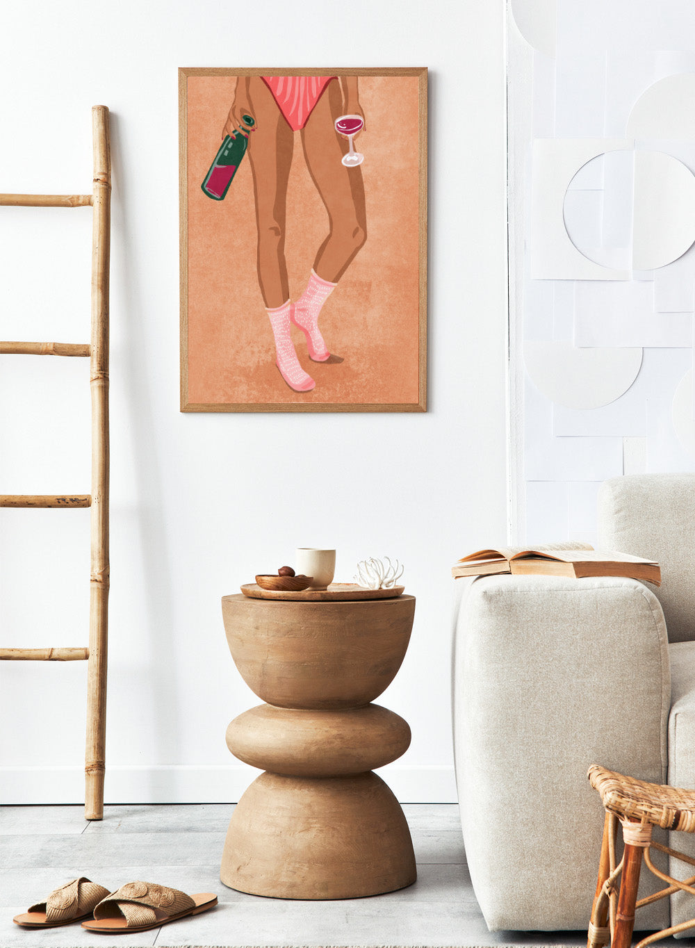 Illustration of a person's legs wearing pink socks with text, holding a bottle and a glass on a peach background. Wine and Socks by Raissa Oltmanns is a modern woman art print featuring wine bottle and glass in bold contemporary wall poster style.