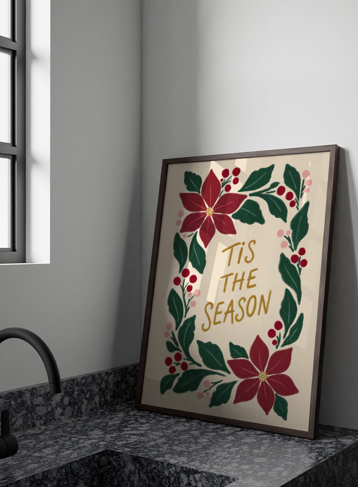 Shop Tis The Season Wreath by Katarzyna Gąsiorowska, a Christmas wall art print poster featuring poinsettias, berries, greenery, and festive holiday lettering.