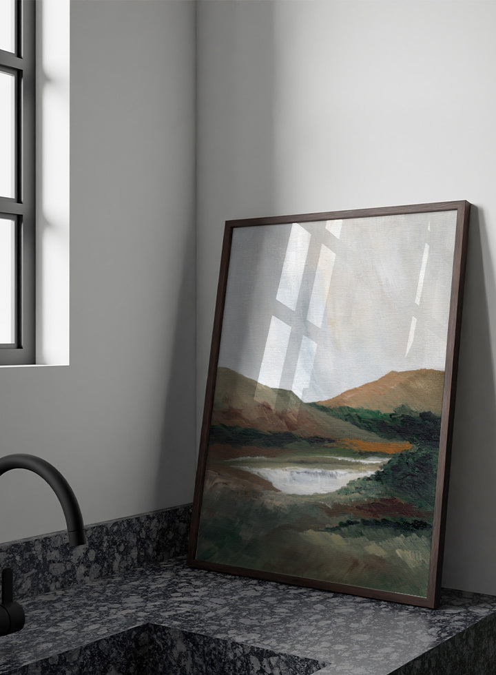 An impressionistic landscape painting of a river or waterfall flowing through a valley, with brown and green hills under a pale sky. Shop Serene Mountain Lake by Nikita Jariwala, a mountain landscape wall art print poster featuring a peaceful lake, wooded hills, and soft green tones.