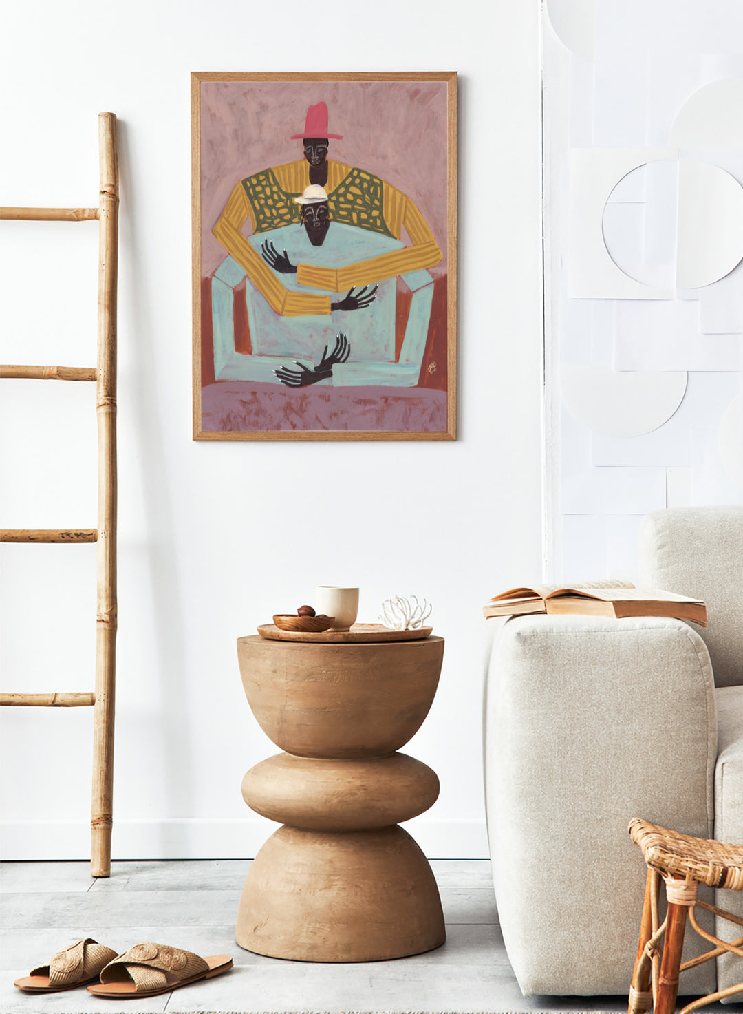 Artistic depiction of two figures sitting together with a pink background. The Hug by Studio IMO (Ibi Meier-Oruitemeka) is a modern figurative art print featuring two figures embracing in a bold contemporary wall poster design.