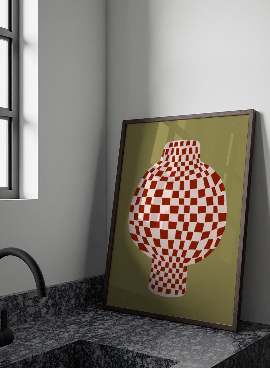 A stylized graphic print of a vase with a red and off-white checkerboard pattern, set against an olive green background. Retro Checkered Vase by The Art Concept is a modern still life art print featuring a red checkered vase, olive green background, and playful retro style.