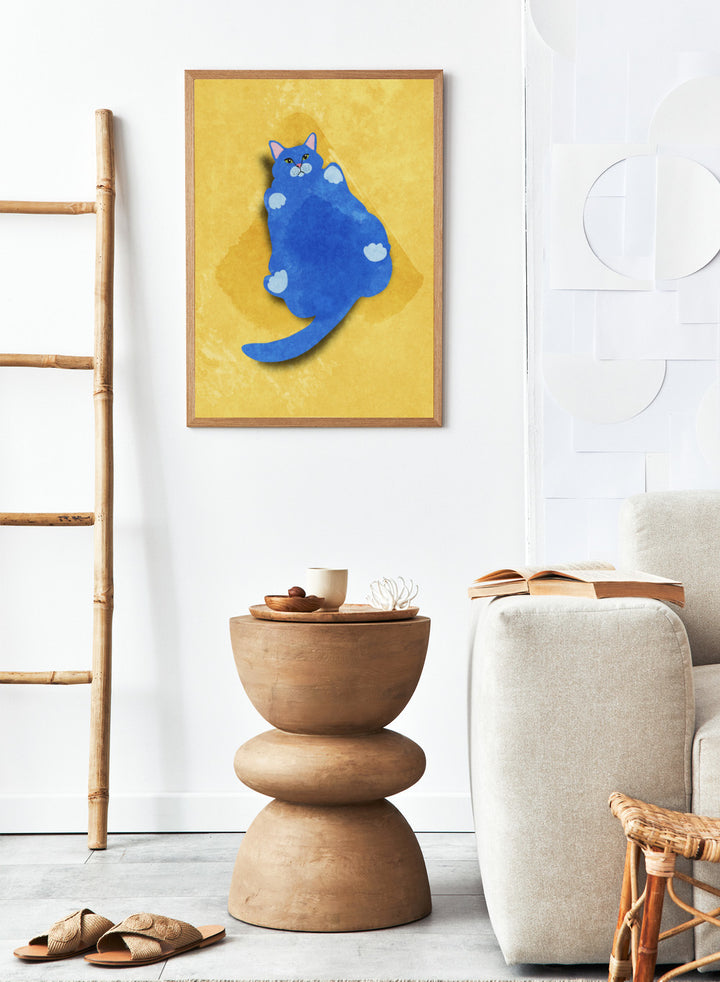 Blue cat illustration on a yellow textured background. Fat Cat by Raissa Oltmanns is a modern cat art print featuring a bold blue feline on yellow background in contemporary wall poster style.
