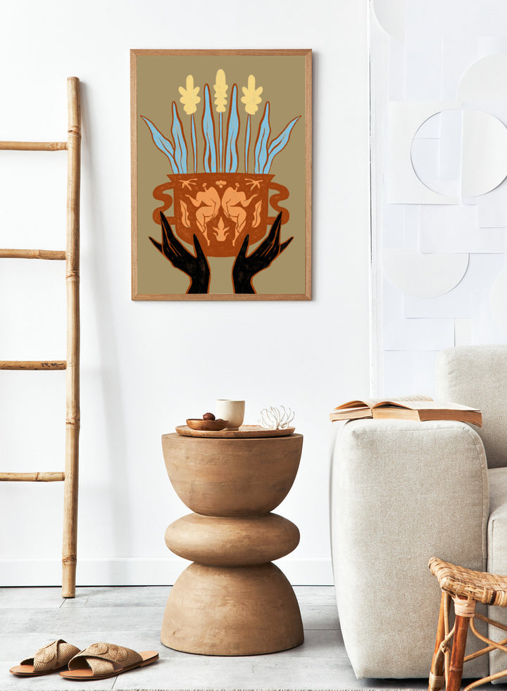 Decorative illustration of a vase with floral design and hands holding it, on a beige background. Vessel Collection: Growth by Arty Guava art print, modern vase wall poster with botanical illustration, contemporary minimalist line artwork.