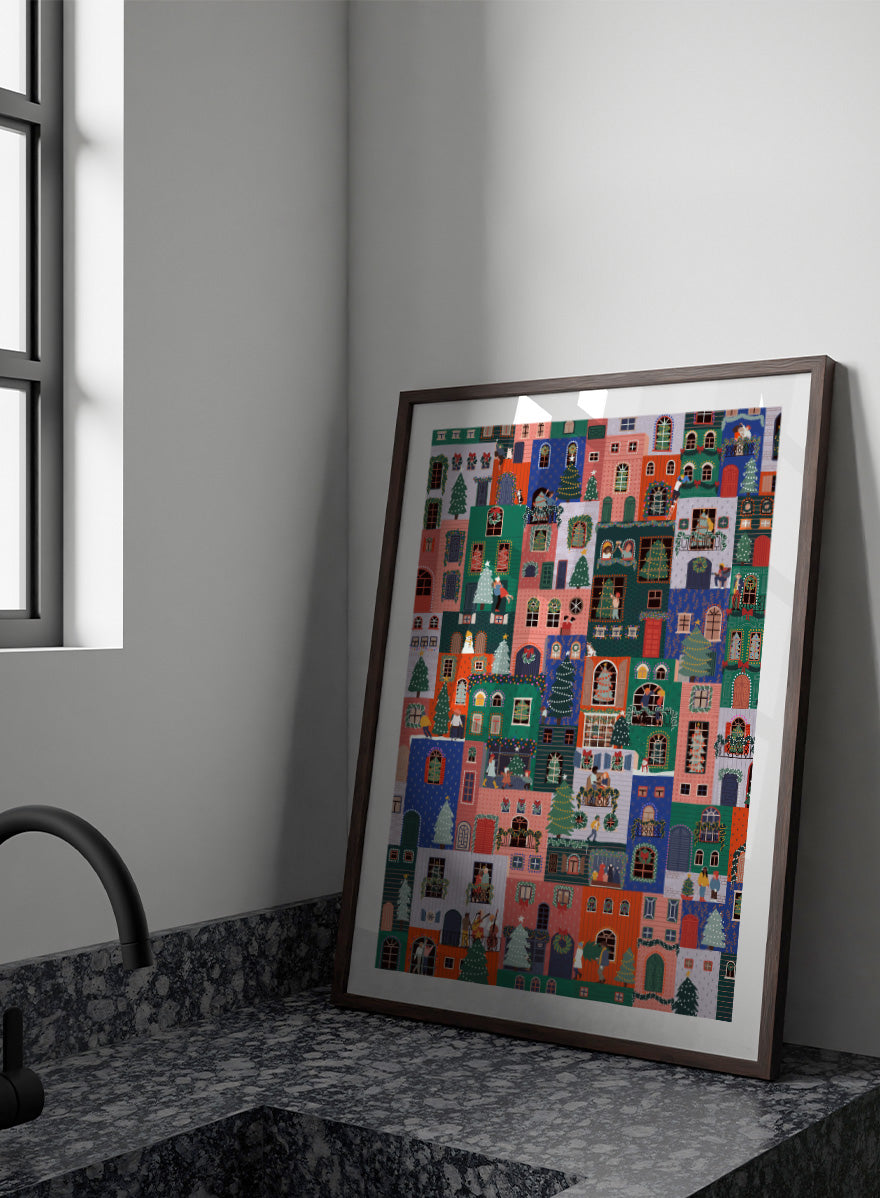 Shop Festive Christmas Town by Ceyda Alasar, a colorful Christmas wall art print poster featuring a lively holiday town filled with decorated homes and festive scenes.