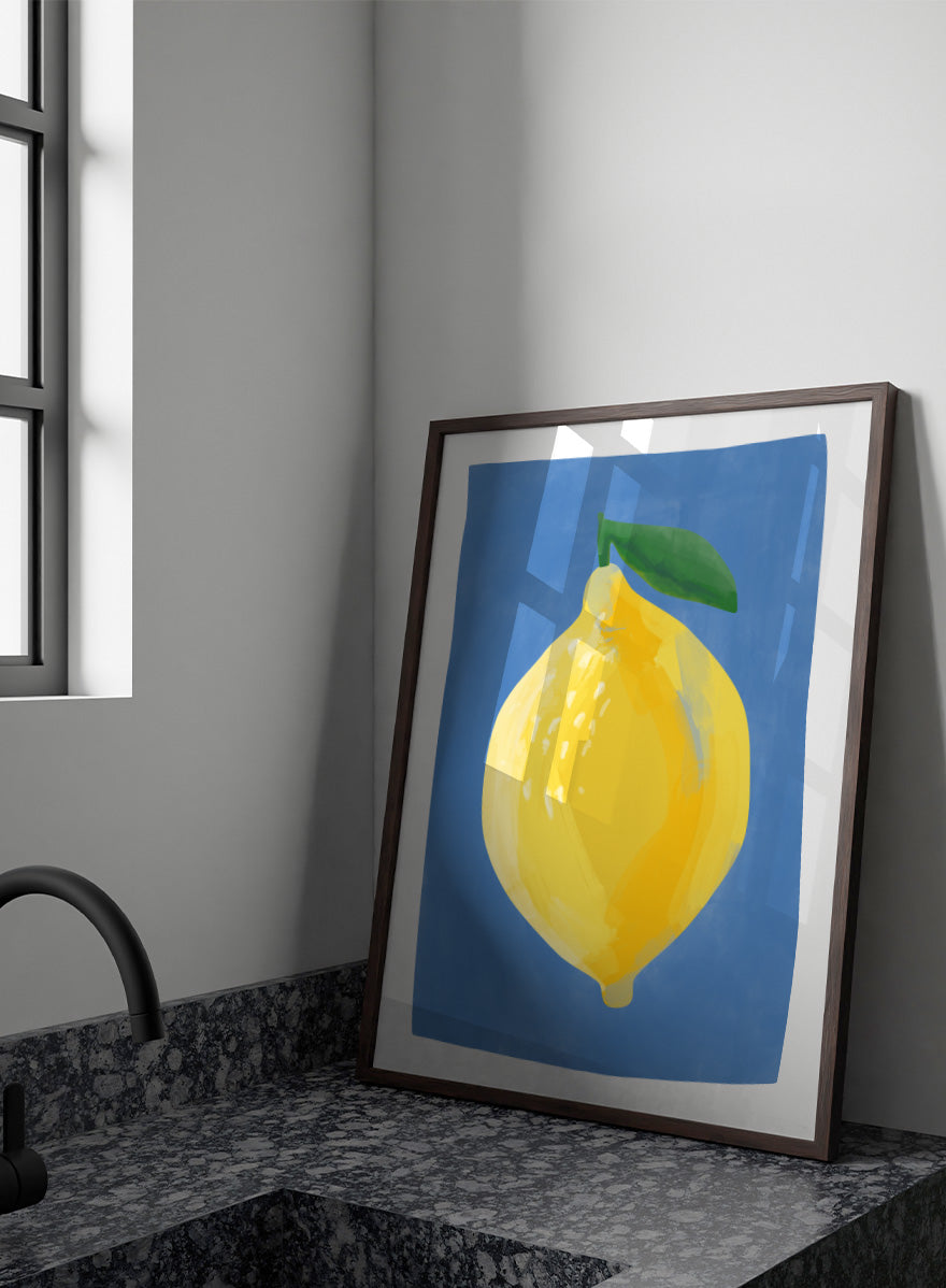 Shop Bright Yellow Lemon by Elena Ristova, a colorful lemon wall art print poster featuring an oversized yellow fruit, green leaf, and vivid blue background.