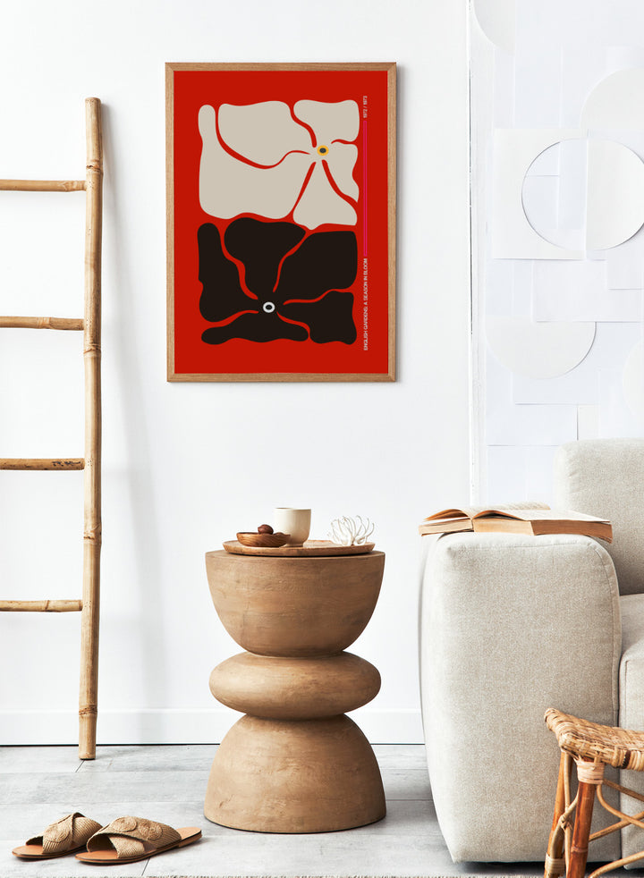 Abstract design with beige and black shapes on a red background. Two By Two Flower Red by Frances Collett is a modern abstract floral art print featuring two bold flowers in red, black, and cream tones. Officially licensed wall poster with optional framing.