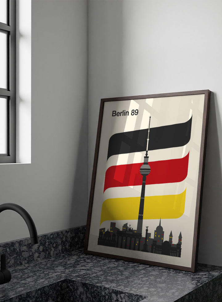 A minimalist travel poster for Berlin 1989, featuring the Fernsehturm TV tower and city skyline against a cream background, with stylized German flag stripes in black, white, red, and yellow. Berlin 89 German Skyline by Retrodrome travel art print featuring the Fernsehturm, Berlin skyline, German flag colors, and bold retro poster design.