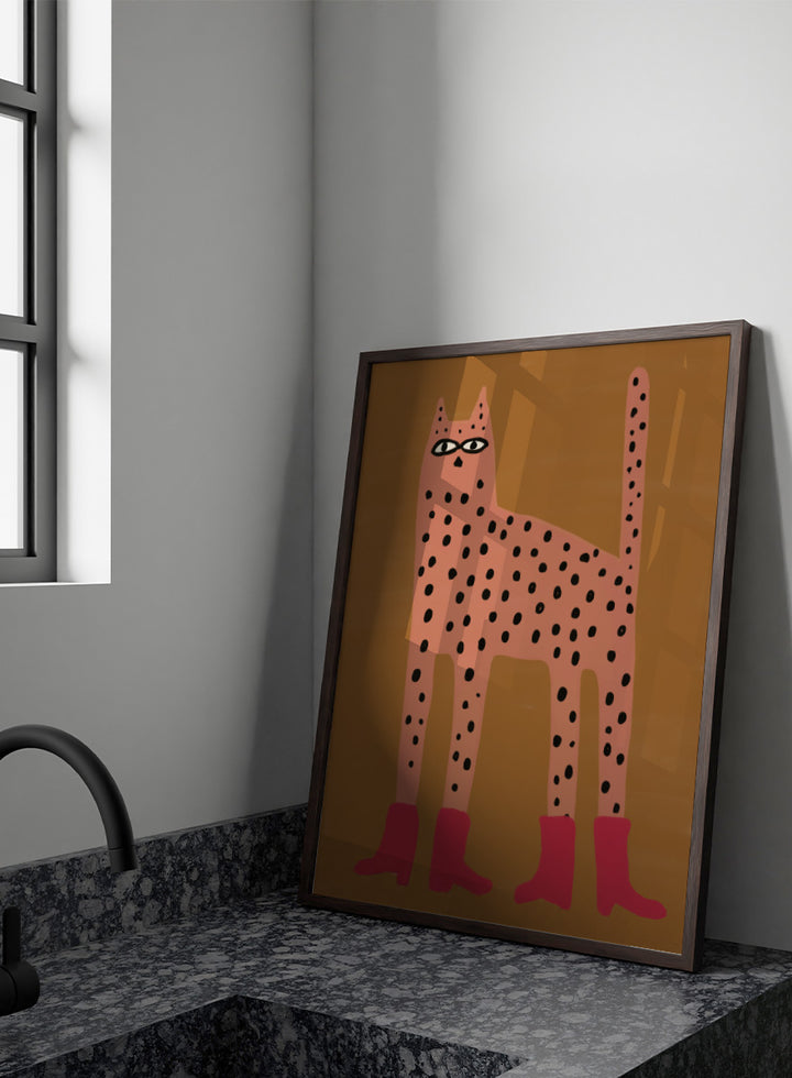 A stylized art print of a tall spotted cat in a pinkish-orange tone with black spots and bright pink boots, set against a warm brown background. Spotted Cat in Boots by The Art Concept playful cat art print featuring a pink spotted cat with long legs, red boots, and a warm ochre background.