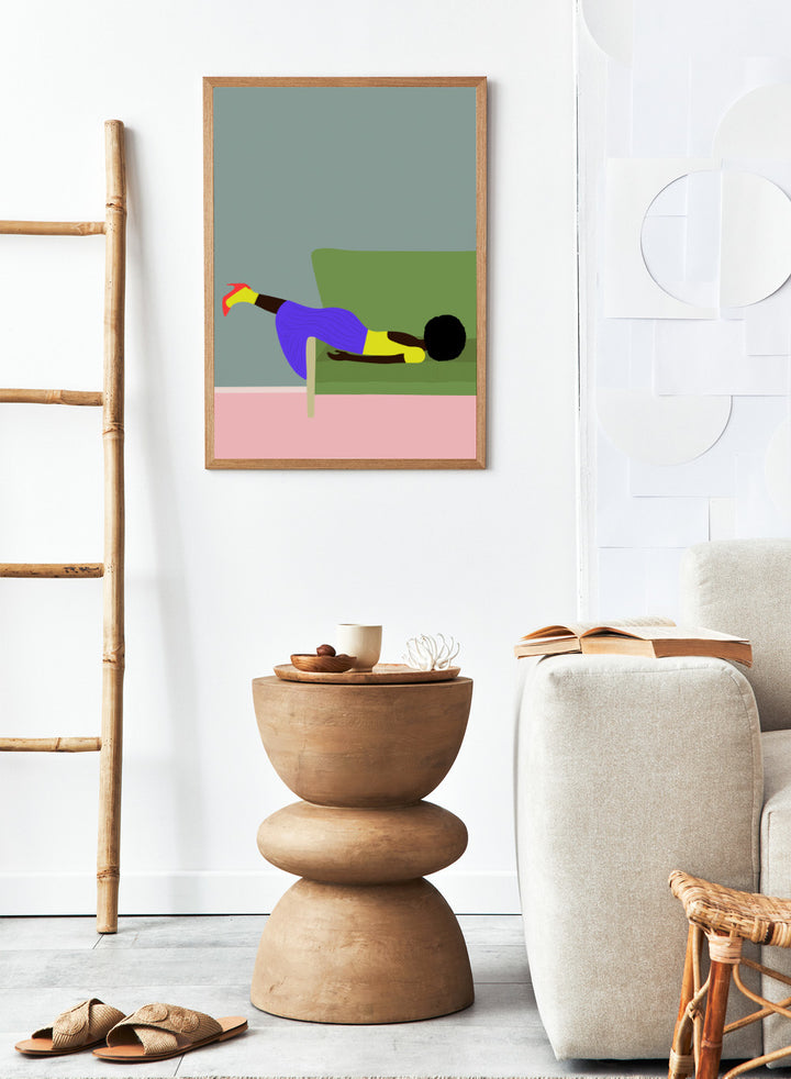 Simplified illustration of a person lying on a green couch with a gray wall and pink floor. Wendy’s Mood by Jota de Jai is a modern art print of a woman lounging dramatically on a green couch, officially licensed wall poster with fine art printing and framing.