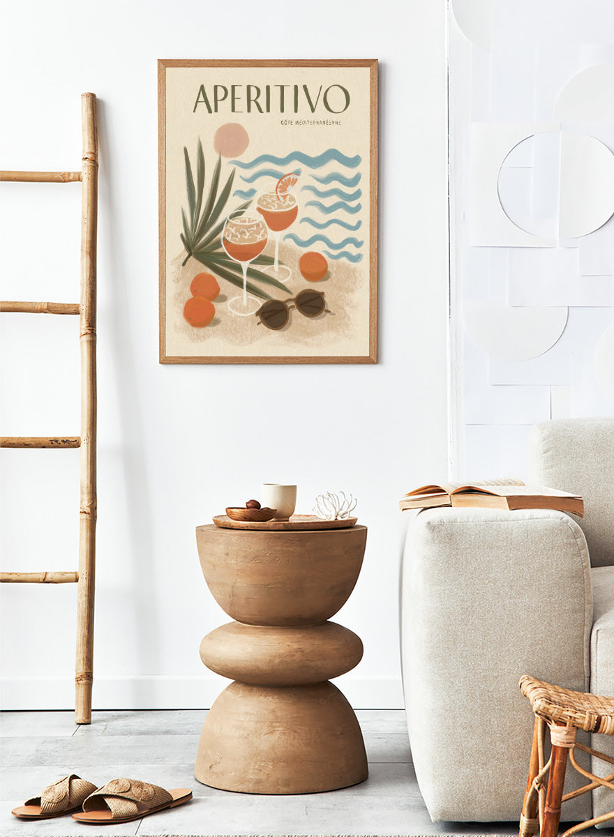 A travel-style poster reading “APERITIVO” with “CÓTE MEDITERRANÉENNE” beneath it, showing illustrated cocktails, citrus fruits, palm leaves, blue ocean waves, and sunglasses on a warm beige background.Aperitivo Beach Day by Katarzyna Gąsiorowska Mediterranean art print featuring spritz cocktails, oranges, sunglasses, and vintage coastal style.