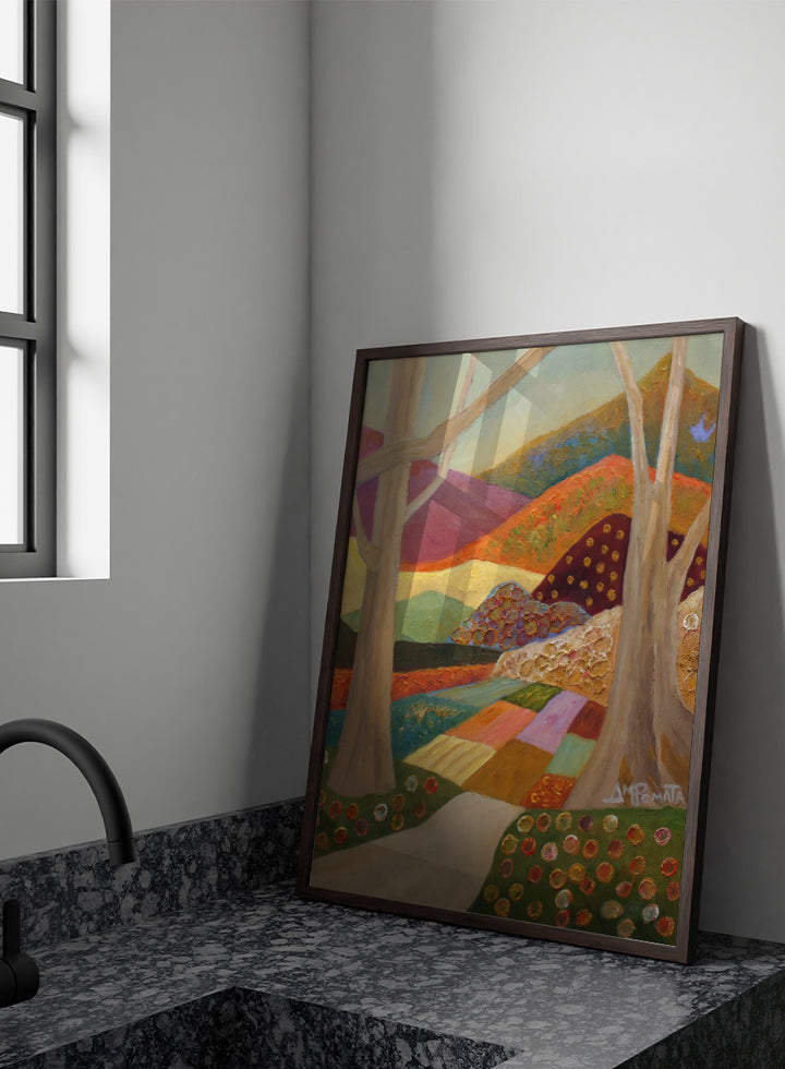A colorful landscape painting featuring stylized trees, a winding path, patchwork fields, and rolling hills in warm and cool tones, with a visible artist signature in the lower right. Shop Colorful Field Path by Angeles M. Pomata, an autumn landscape art print featuring a winding path, textured fields, flowers, and rolling countryside.