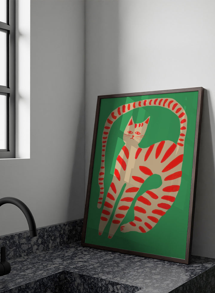 A stylized art print of a cat curled up in a circle, featuring a beige body with red stripes on a solid green background. Striped Cat Stretching by The Art Concept art print featuring a playful striped cat, green background, and bold red accents.