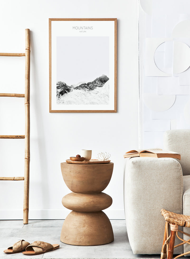 Black and white mountain landscape with 'Mountains Natura' text. Serene Peaks by The MIUUS Studio is a black and white mountain photography art print and wall poster featuring snowy peaks, minimalist composition, and modern neutral design.