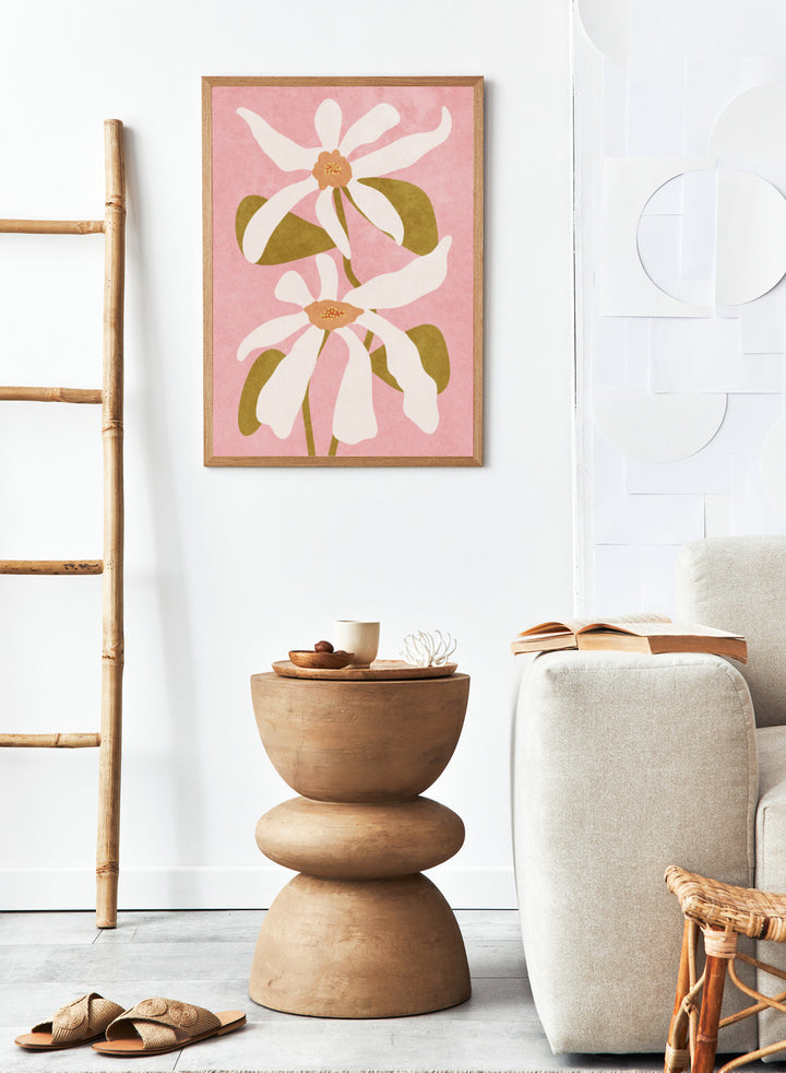Two white flowers with green stems on a pink background. Abstract Flowers I by Raissa Oltmanns is a modern floral art print featuring white blooms on pink in contemporary botanical wall poster style.