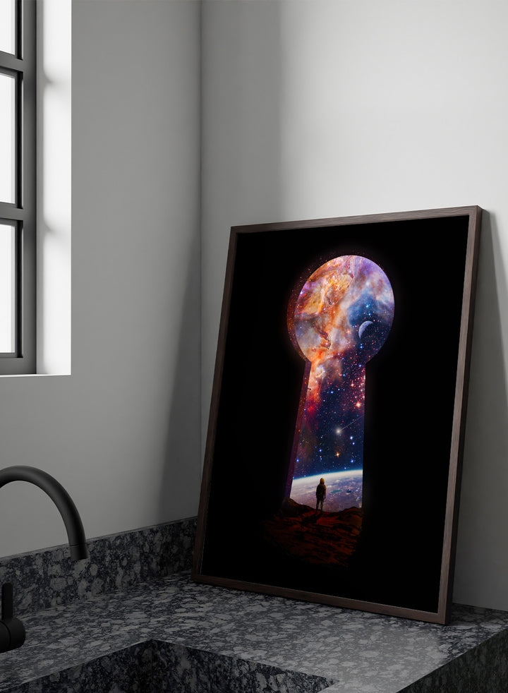 Keyhole-shaped portal to space with a silhouette of a person looking into it. The Cosmic Keyhole by Nicebleed is a surreal space art print featuring an astronaut looking through a cosmic keyhole, modern aesthetic wall poster.