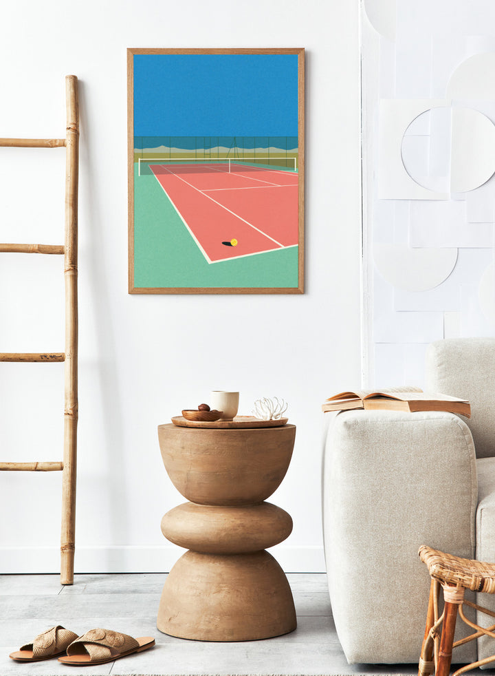 Illustration of a tennis court with a ball on the ground and mountains in the background. Tennis Court in the Desert by Rosi Feist is a modern minimalist fine art print of a pink tennis court in a surreal desert landscape. Officially licensed wall poster with optional artisan framing.