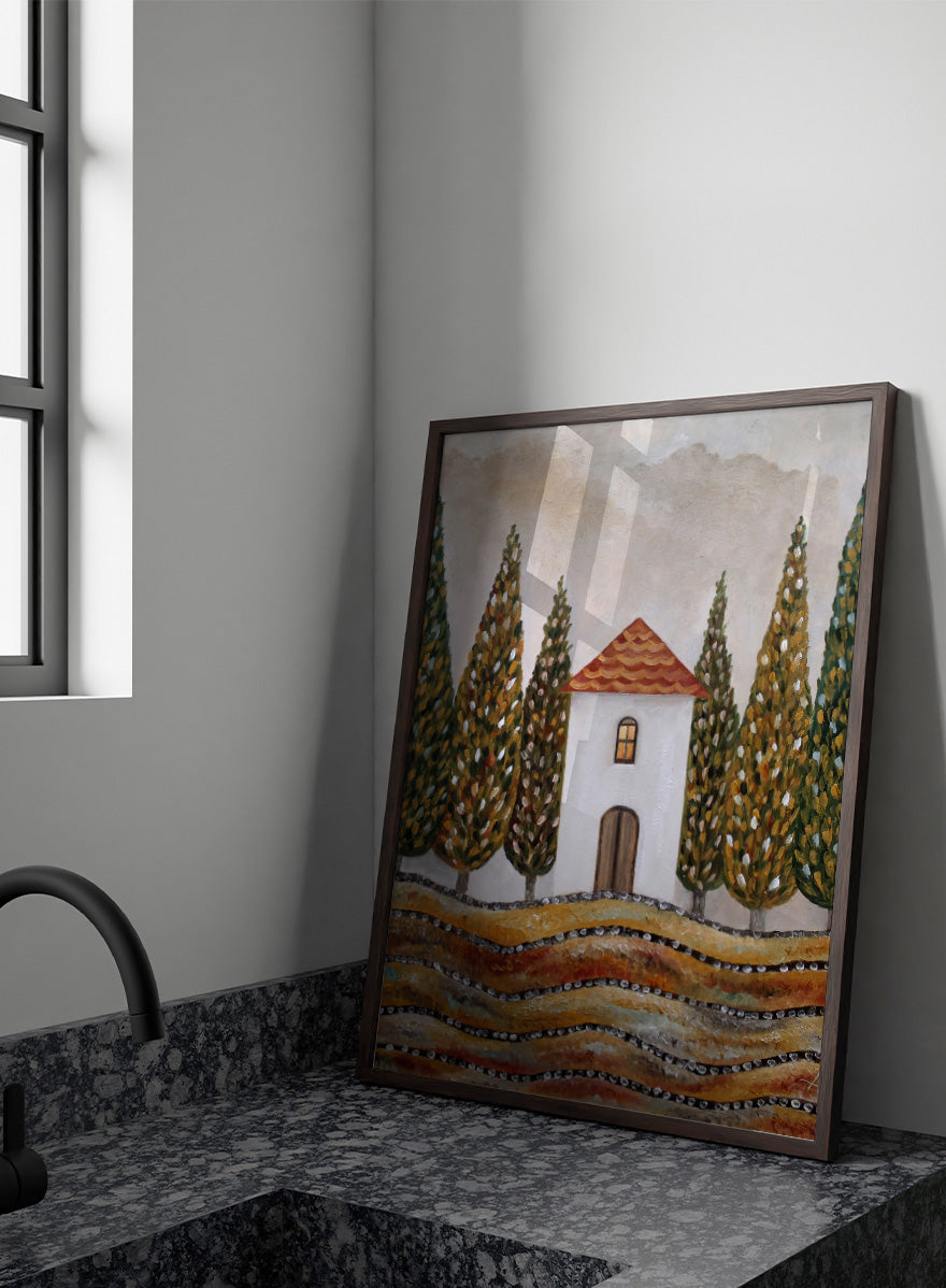 A stylized landscape painting of a small white house with a red-orange tiled roof, surrounded by tall green and gold trees, with wavy golden fields in the foreground. Shop Tuscan Cypress House by Angeles M. Pomata, an autumn landscape art print featuring a white country house, tall cypress trees, terracotta roof, and warm earthy tones.