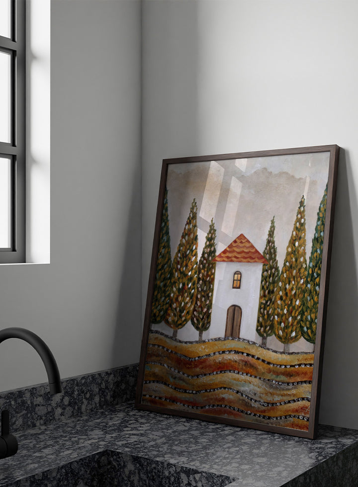 A stylized landscape painting of a small white house with a red-orange tiled roof, surrounded by tall green and gold trees, with wavy golden fields in the foreground. Shop Tuscan Cypress House by Angeles M. Pomata, an autumn landscape art print featuring a white country house, tall cypress trees, terracotta roof, and warm earthy tones.