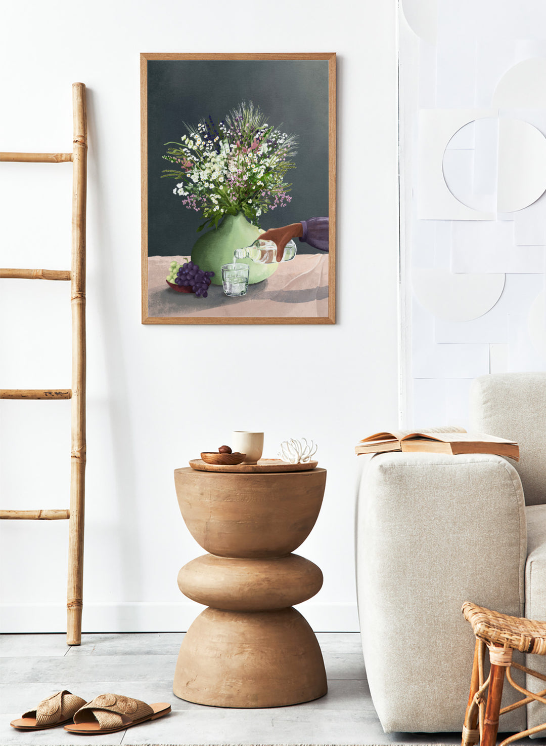 Still life with a green vase of flowers, grapes, and a glass being filled with a bottle. Frivolous Afternoon by Goed Blauw is a modern still life art print and wall poster featuring wildflowers, grapes, and a quiet pouring moment in soft, muted tones.