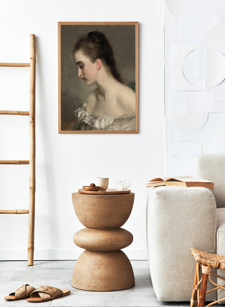 The Debutant by Gustave Jean Jacquet is a vintage portrait print of a young woman in profile with pearls in her hair and a white ruffled dress.