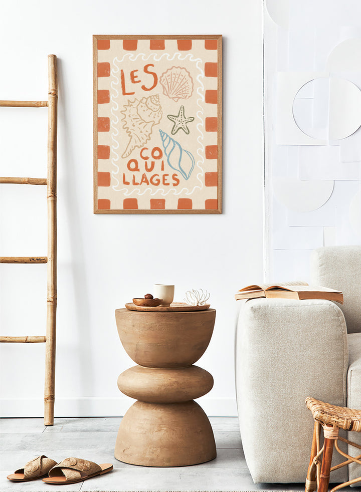 A square decorative print or card with the French text “LES COQUILLAGES” in orange lettering, surrounded by illustrated seashells and a starfish on a cream background with an orange-and-white check border. Rustic French Seashells by Katarzyna Gąsiorowska coastal art print with hand-drawn shells, a starfish, French lettering, and terracotta checks.