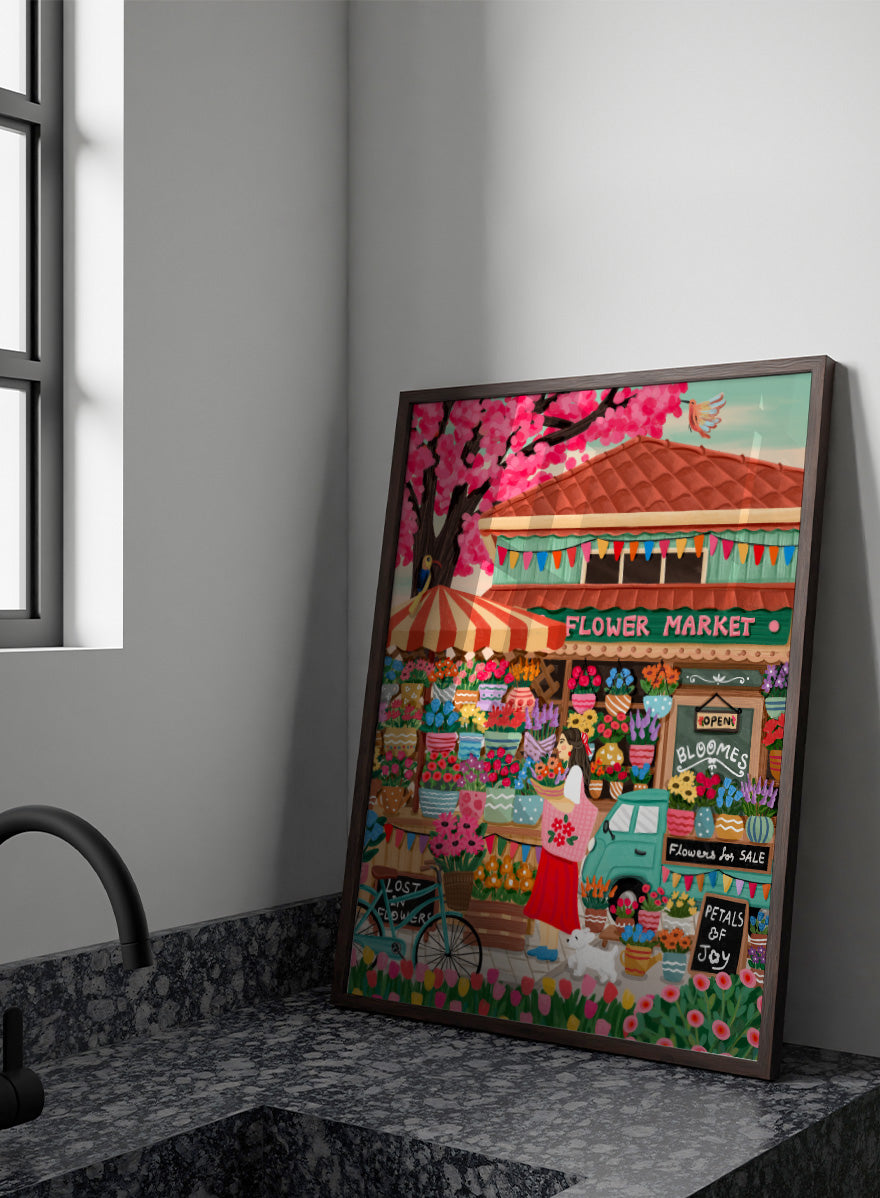 A colorful illustrated flower market scene with a shop front, blooming pink cherry blossoms, flower stalls, a woman standing by a bicycle, and signs reading &