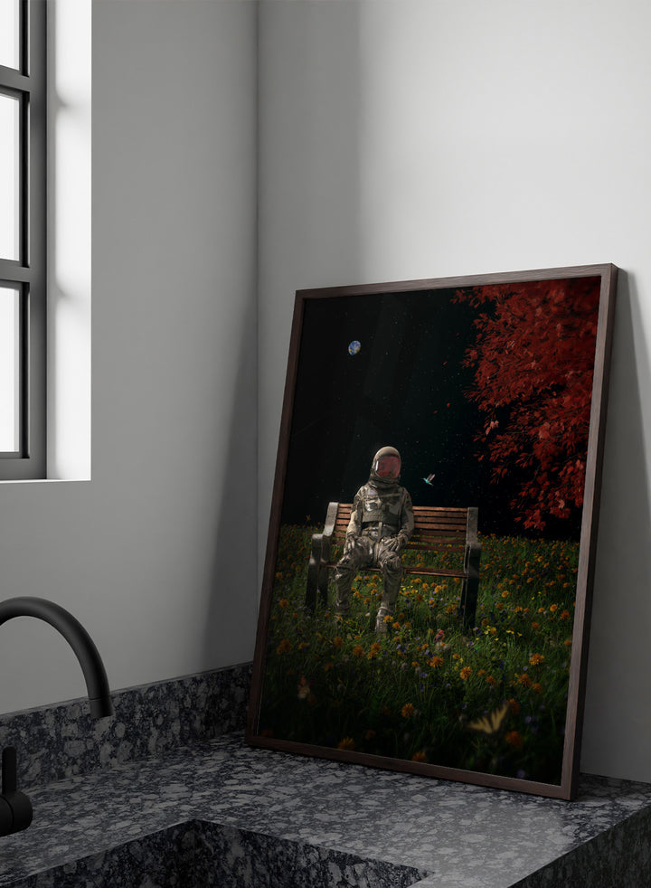 Person in astronaut suit sitting on a bench in a garden with flowers and trees at night. Astronaut Space Garden by Nicebleed is a surreal space art print featuring an astronaut on a bench in a floral field under stars, modern aesthetic wall poster.