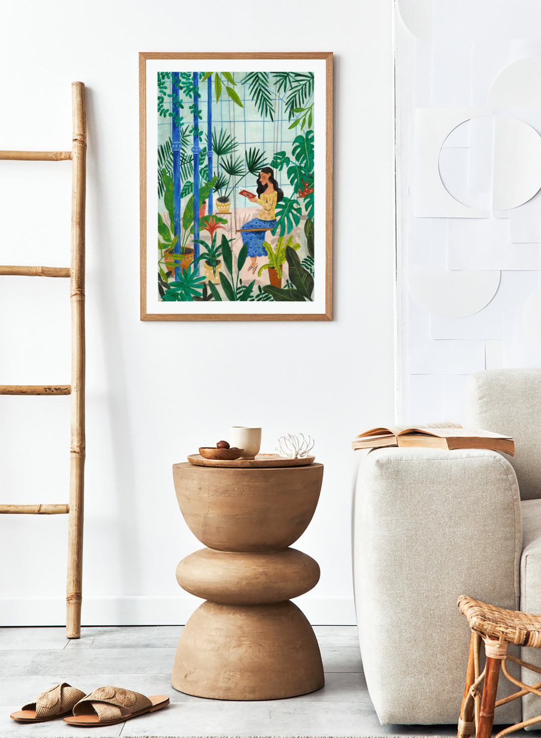 Woman sitting among plants in a room with bamboo and various greenery. Botanical Greenhouse Reader by Caroline Bonne Müller is a fine art print and wall poster featuring a woman reading in a lush indoor garden filled with tropical plants.