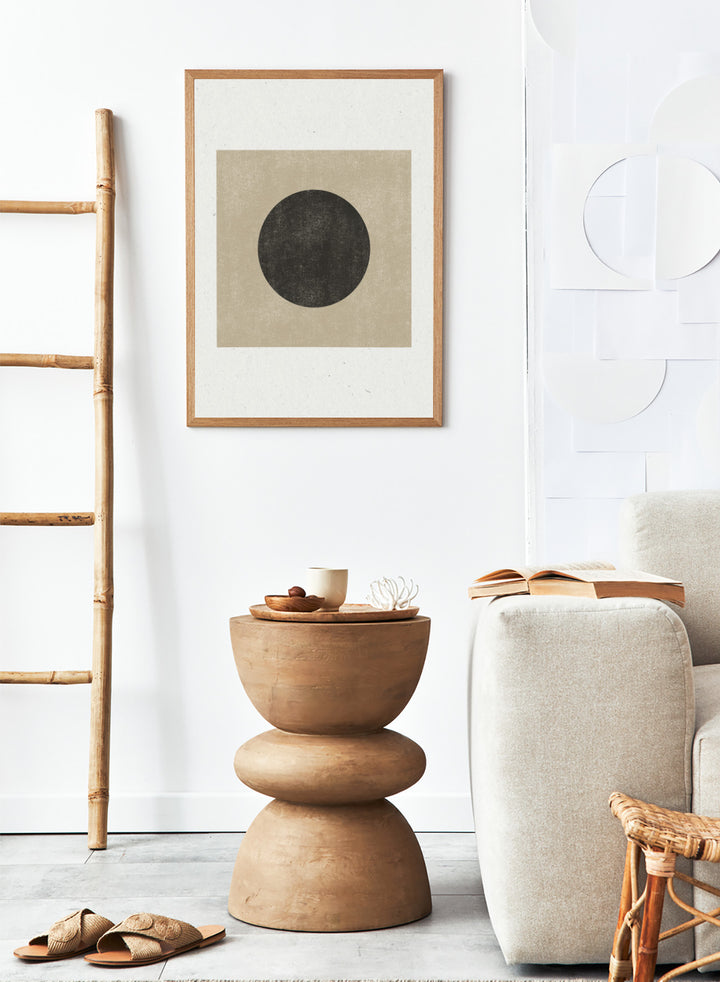 Black circle on beige background. Eclipse Silence by The MIUUS Studio is a minimalist abstract art print and wall poster featuring geometric shapes, neutral tones, and modern textured design.