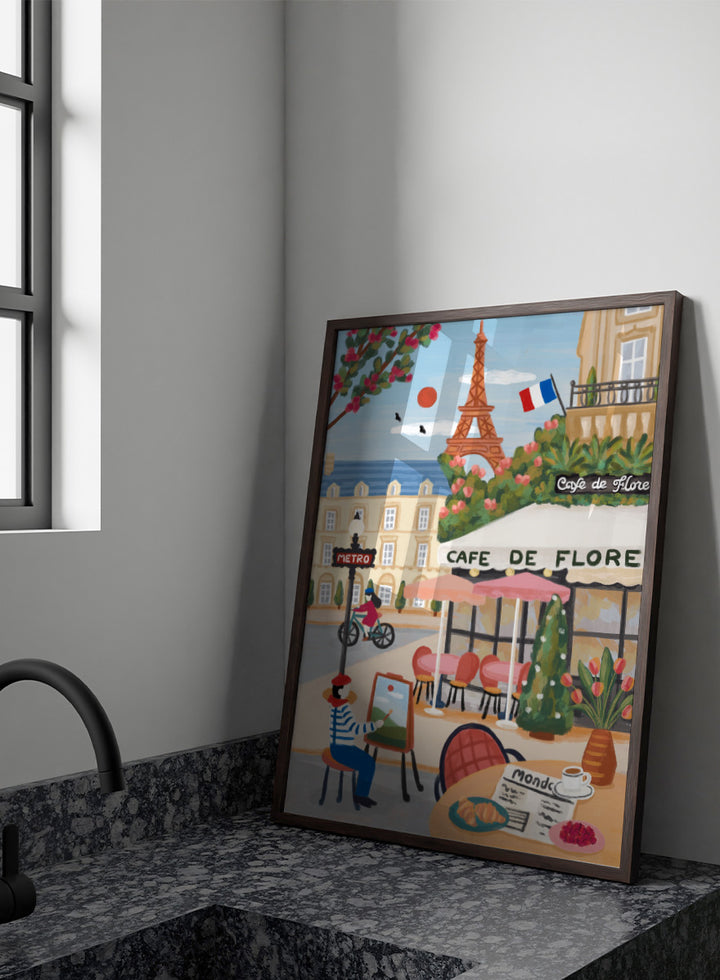 A colorful illustrated Paris street scene with the Eiffel Tower, a cafe exterior labeled Cafe de Flore, a cyclist, a seated painter, flowers, and a French flag. Shop Paris Cafe Life by Nidhi Kachhadiya, a colorful Paris wall art print inspired by French café culture, the Eiffel Tower, and charming European city life.