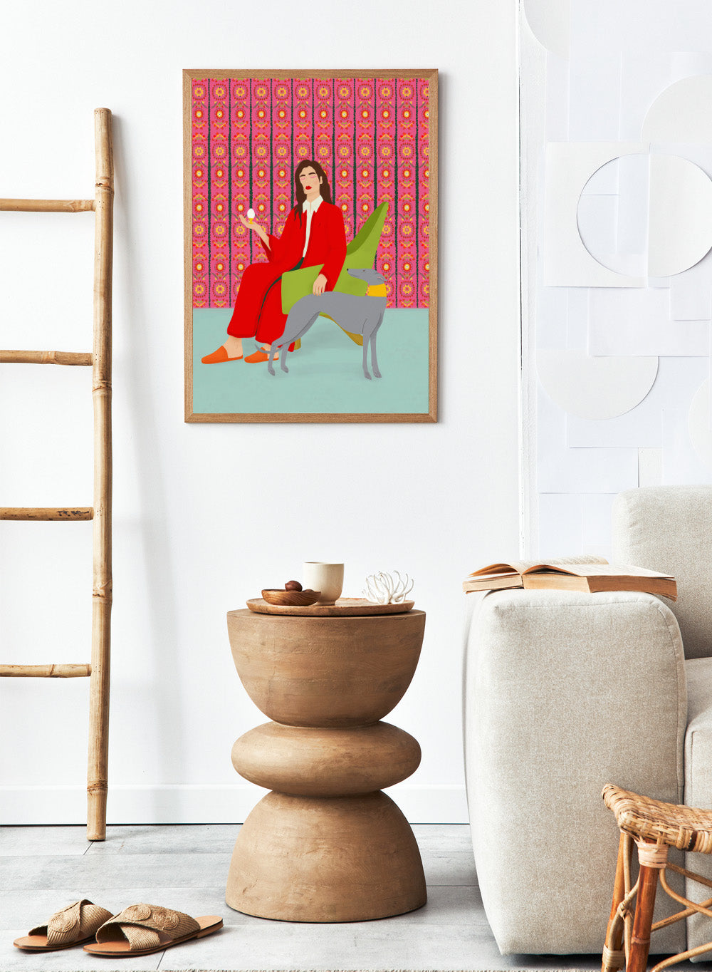 Woman in a red coat sitting on a green chair with a dog, against a pink patterned wall. Wonderful Egg by Jota de Jai is a whimsical modern art print of a woman in a red robe holding an egg with her greyhound, officially licensed wall poster with framing.