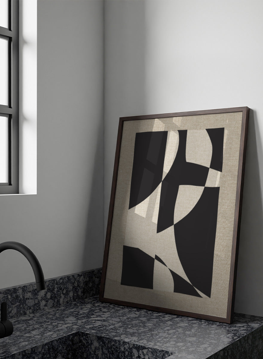 Abstract geometric wall art featuring bold black organic shapes over a warm beige linen-textured background. Shop Skära by Dan Hobday, a contemporary abstract wall art print featuring bold black geometric forms, curved shapes, and warm beige textured tones.