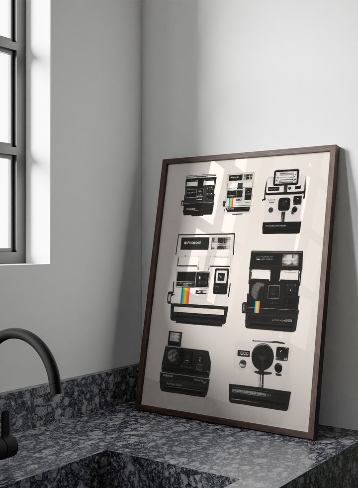 Collection of Polaroid cameras displayed against a white background. Vintage Instant Cameras by Florent Bodart is a retro camera art print featuring classic Polaroid designs, a modern wall poster for photography and design lovers.