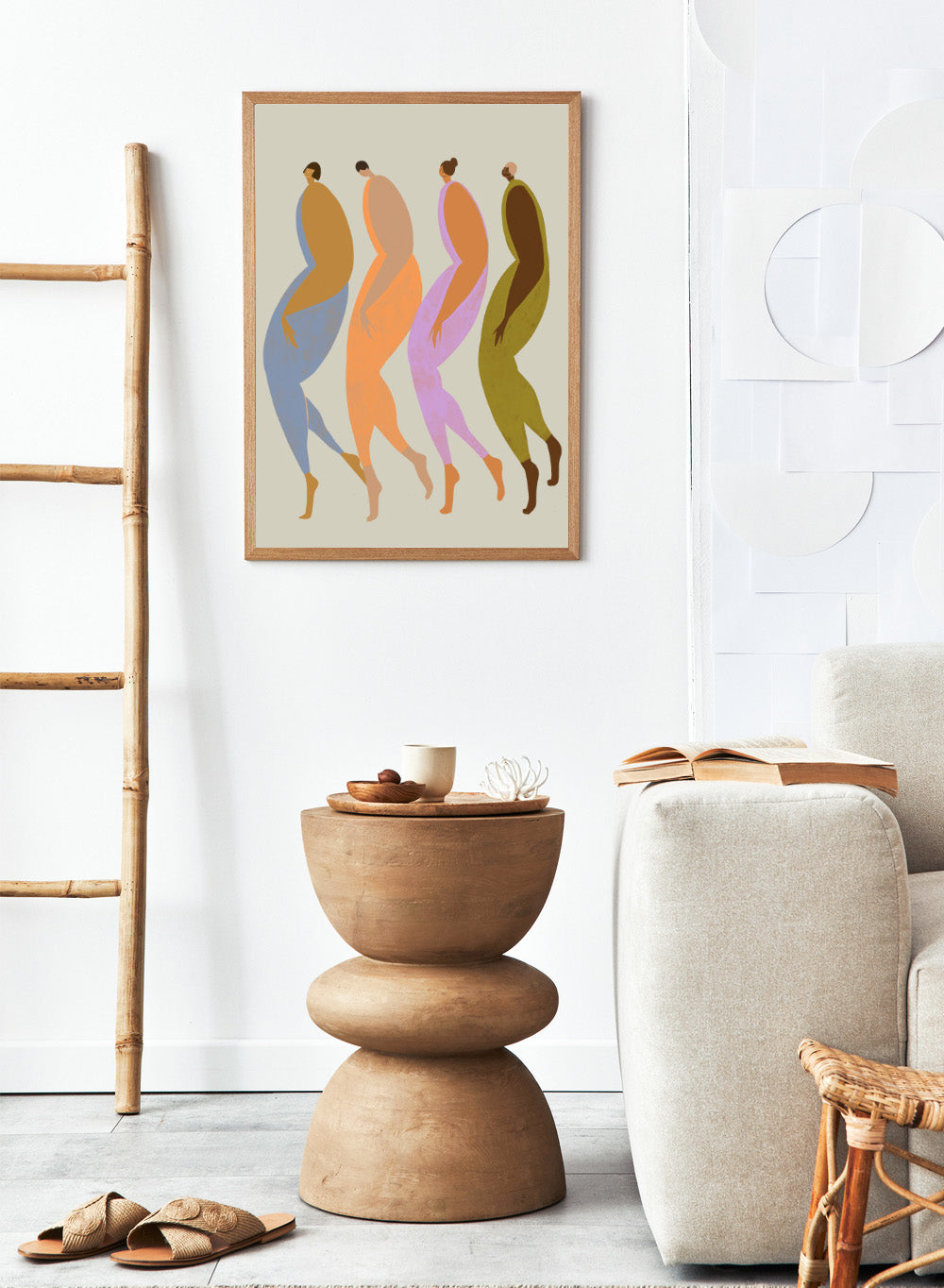 Abstract illustration of four stylized figures in various colors on a beige background. We The Giants by Arty Guava is a modern art print of four bold figures walking together, celebrating strength and sisterhood. Officially licensed wall poster.