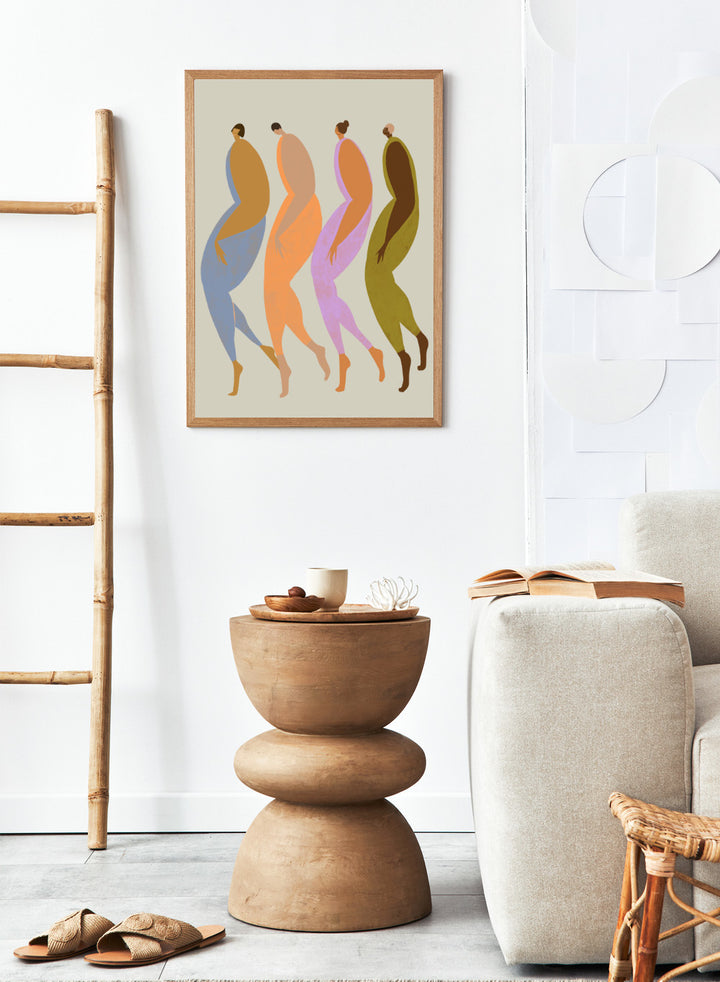 Abstract illustration of four stylized figures in various colors on a beige background. We The Giants by Arty Guava is a modern art print of four bold figures walking together, celebrating strength and sisterhood. Officially licensed wall poster.